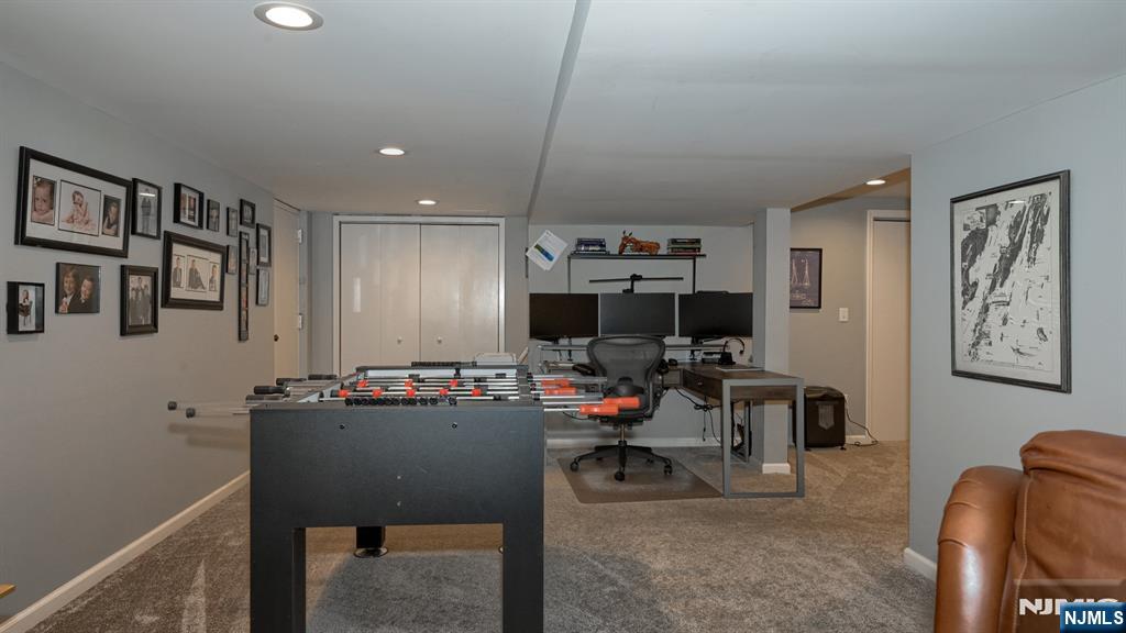 23 Erli Street Wayne, NJ 07470 - Photo 38 of 49 a view of a livingroom with furniture and a flat screen tv