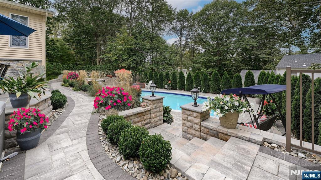 23 Erli Street Wayne, NJ 07470 - Photo 39 of 49 a view of a patio with table and chairs potted plants