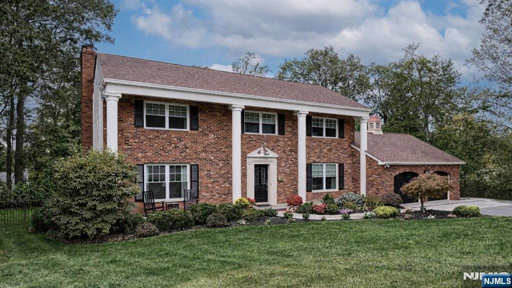 23 Erli Street Wayne, NJ 07470 - Photo 6 of 49 a front view of a house with a garden