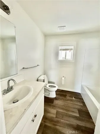 a bathroom with a sink and a window