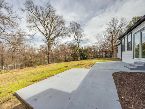 a view of yard with swimming pool