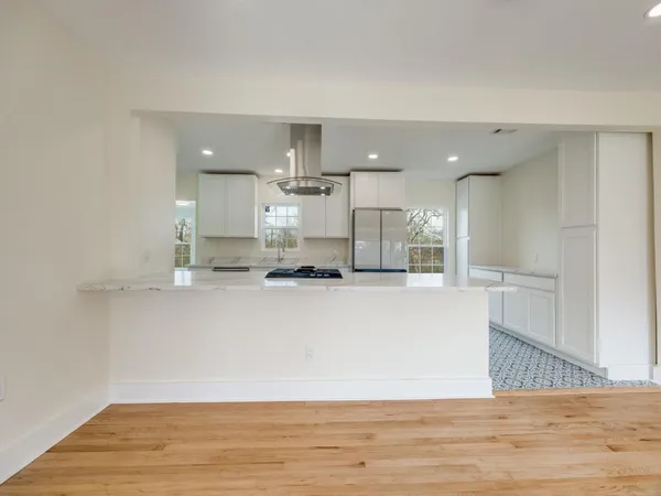 a view of kitchen with wooden floor