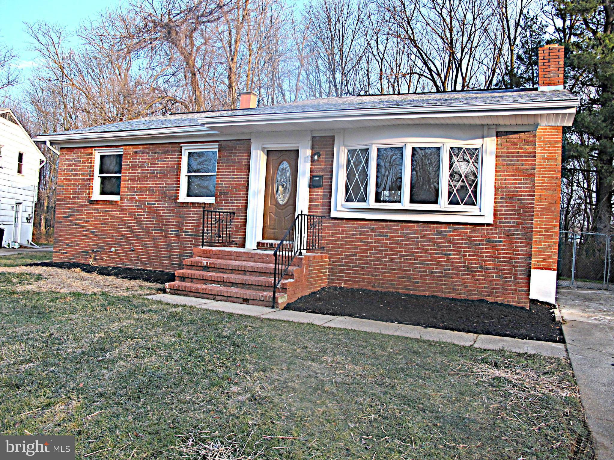 8910 Maplebrook Road Randallstown, MD 21133 - Photo 2 of 18 front view of house with a yard