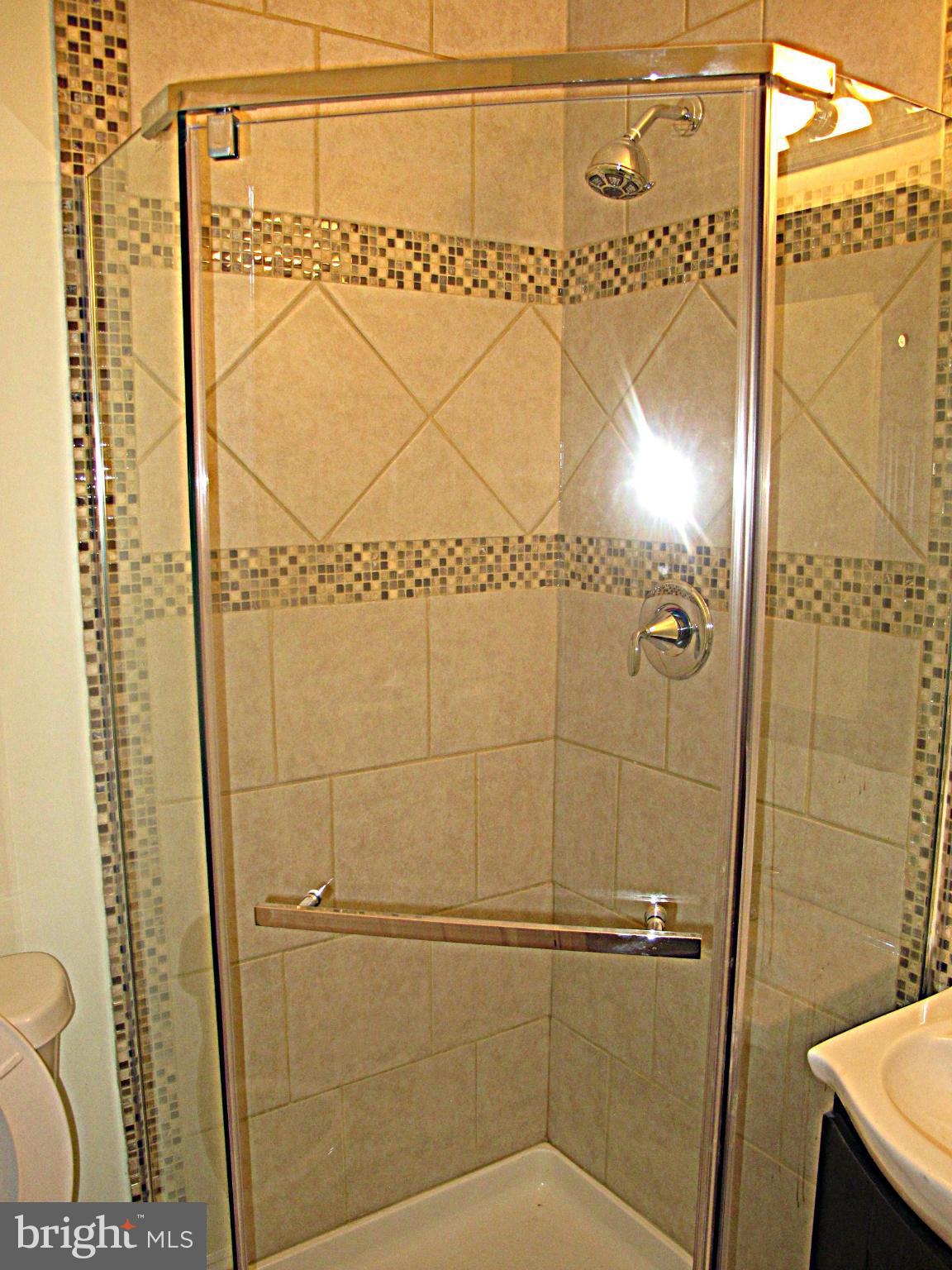 8910 Maplebrook Road Randallstown, MD 21133 - Photo 11 of 18 a bathroom with a shower
