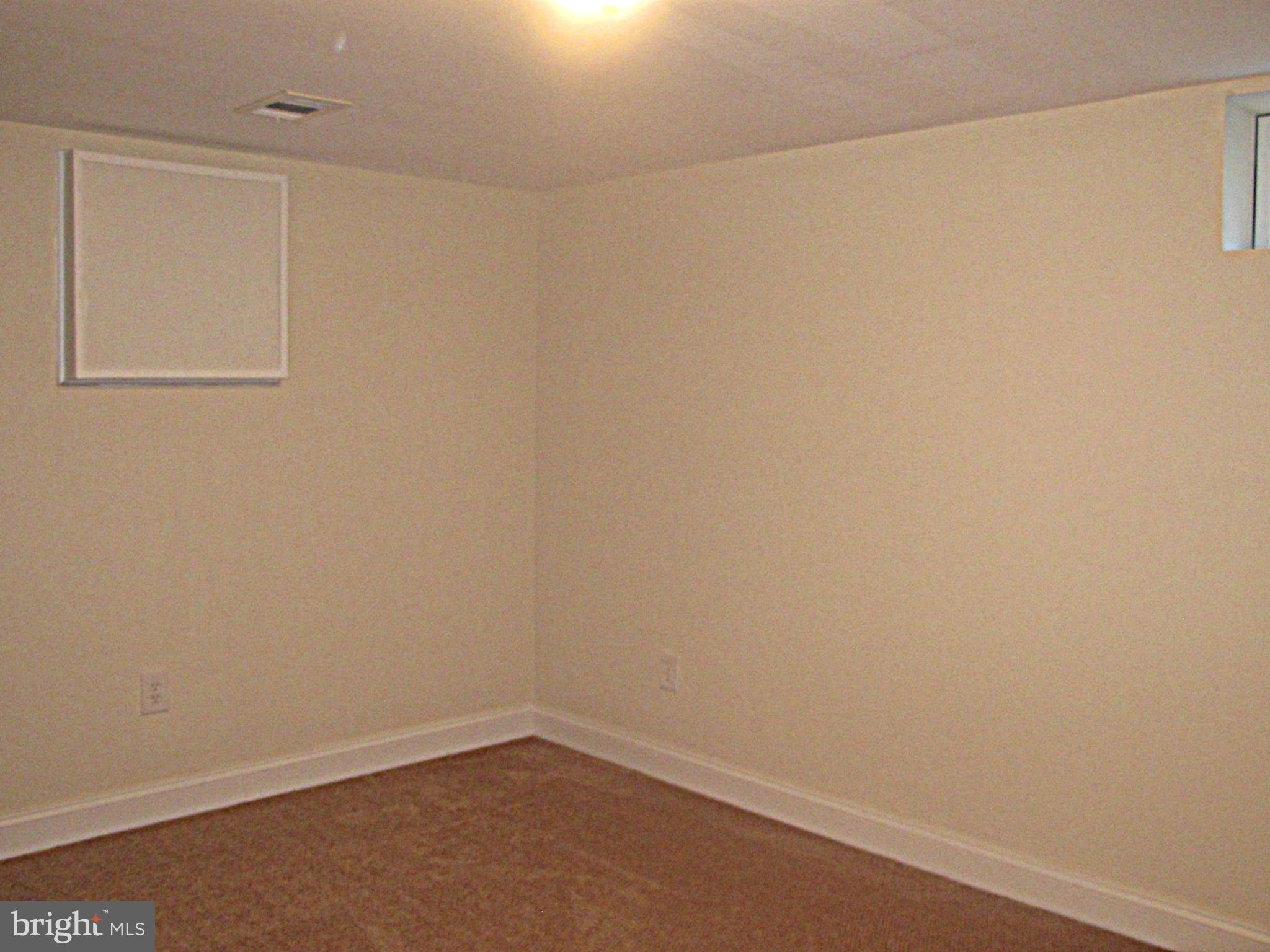 8910 Maplebrook Road Randallstown, MD 21133 - Photo 13 of 18 wooden floor in a empty room