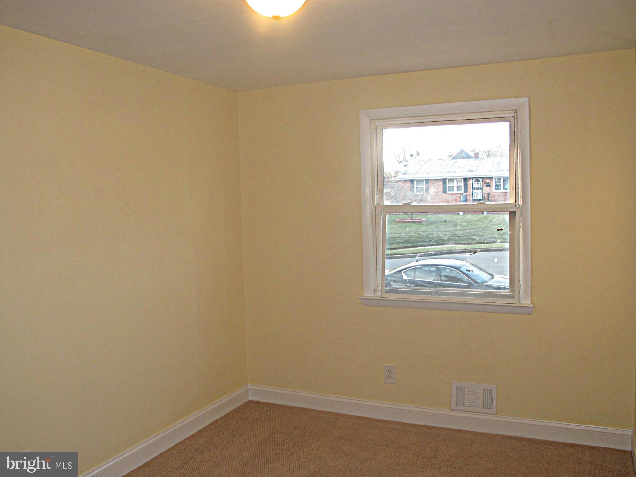 8910 Maplebrook Road Randallstown, MD 21133 - Photo 17 of 18 an empty room with a window