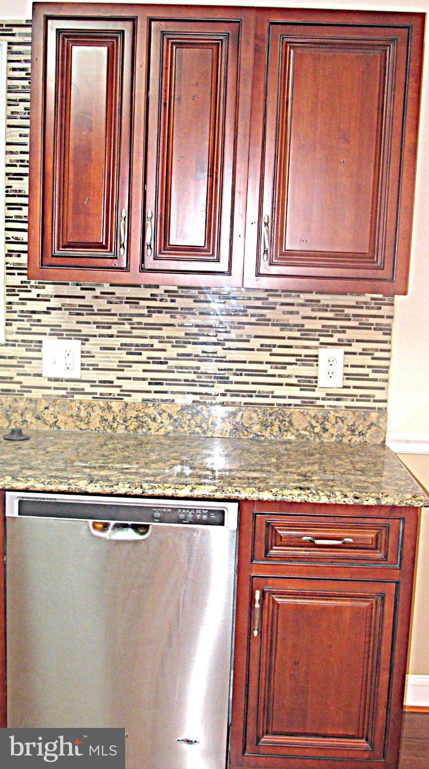 8910 Maplebrook Road Randallstown, MD 21133 - Photo 8 of 18 a view of a refrigerator and window