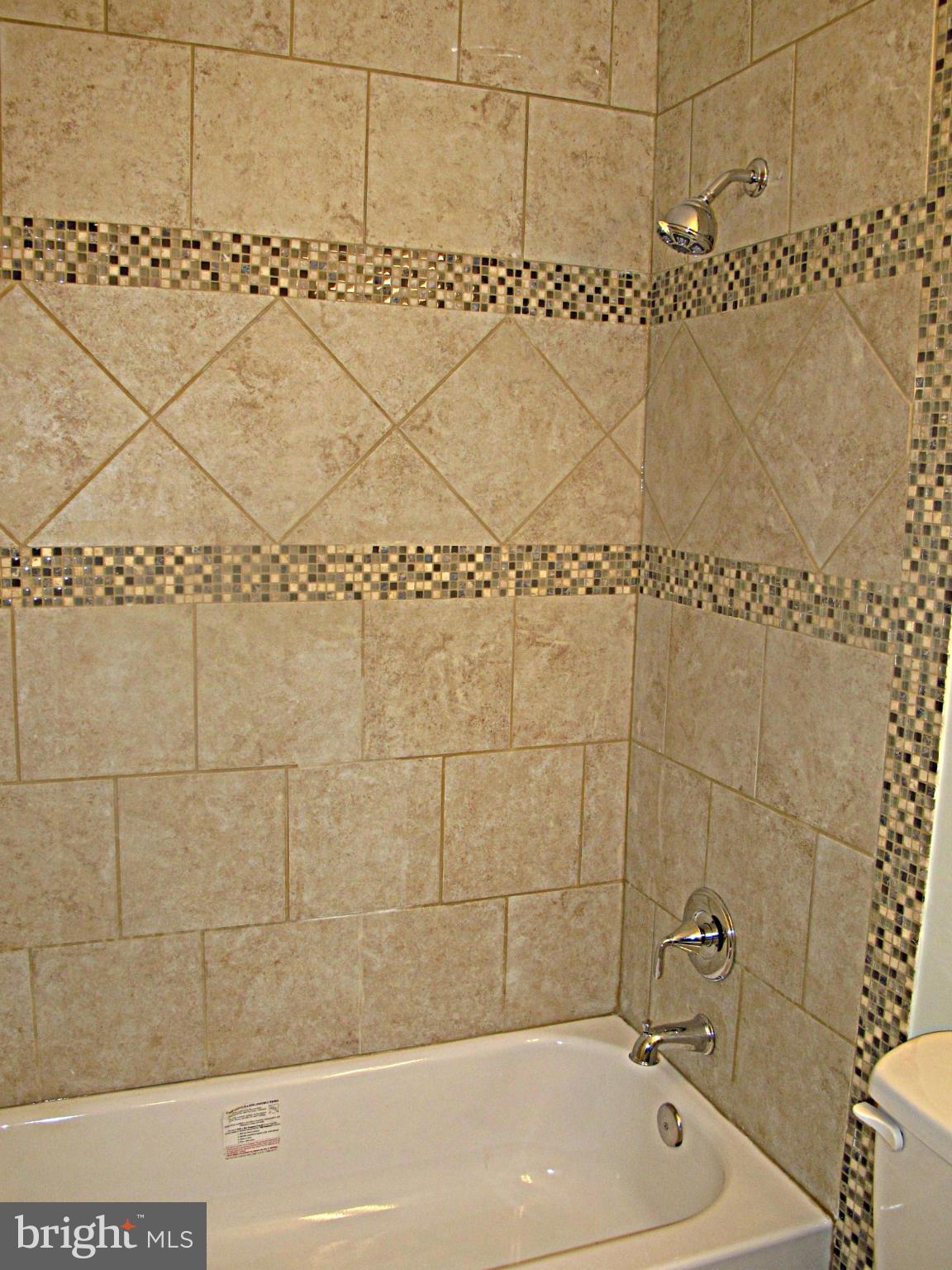 8910 Maplebrook Road Randallstown, MD 21133 - Photo 10 of 18 a bathroom with a bathtub