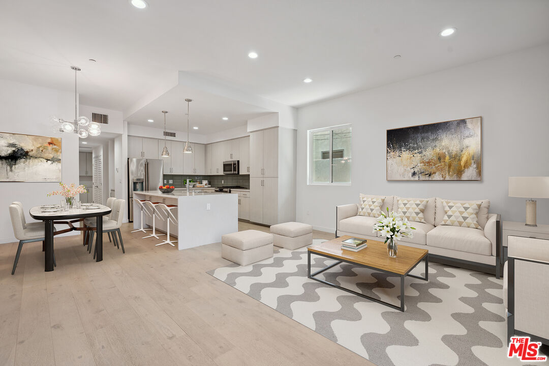 1746 Garfield Place, Unit 101 Los Angeles, CA 90028 - Photo 2 of 28 a living room with furniture and kitchen view