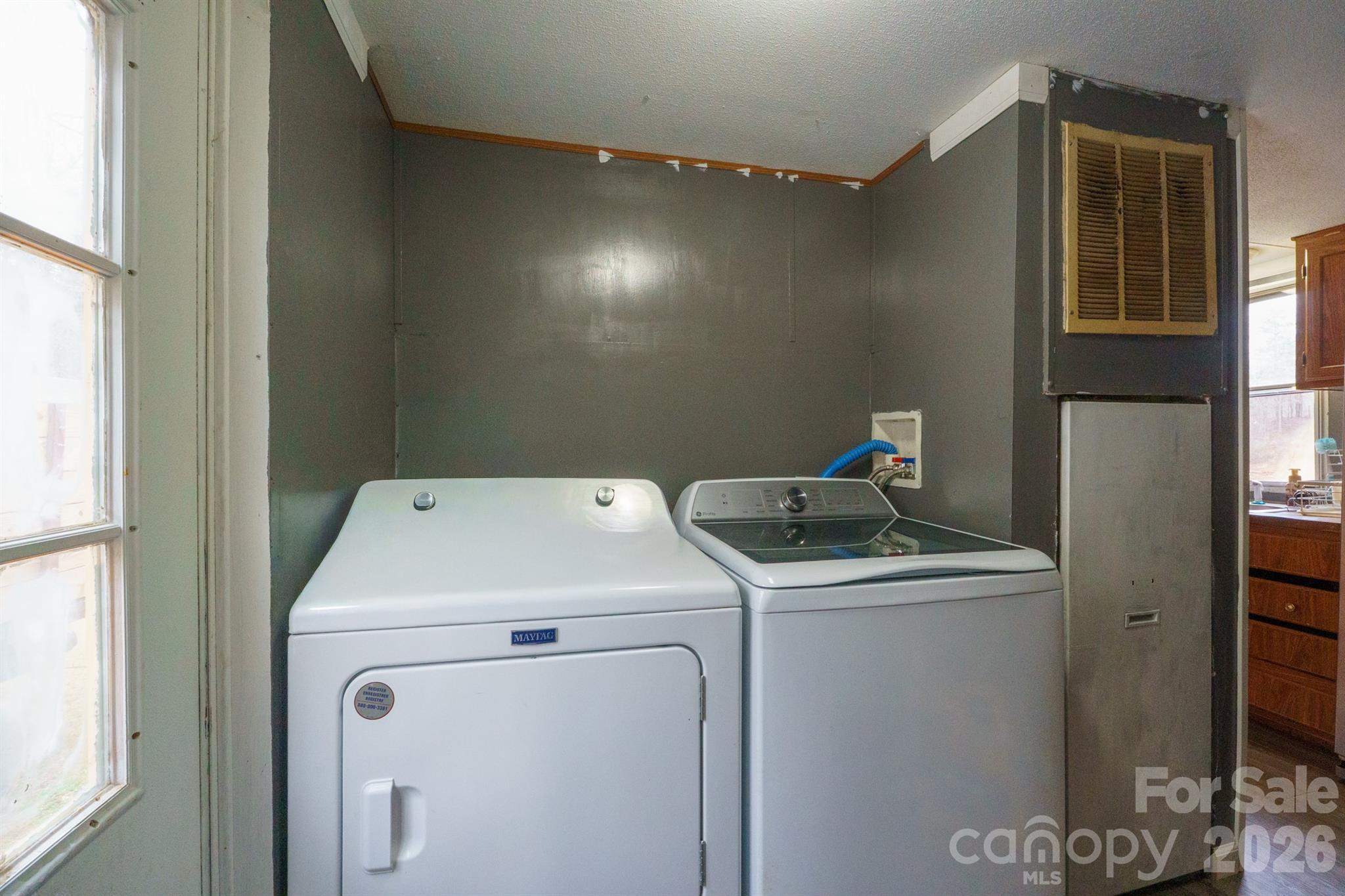 1775 Highway 70 Morganton, NC 28655 - Photo 12 of 18 a utility room with dryer and washer