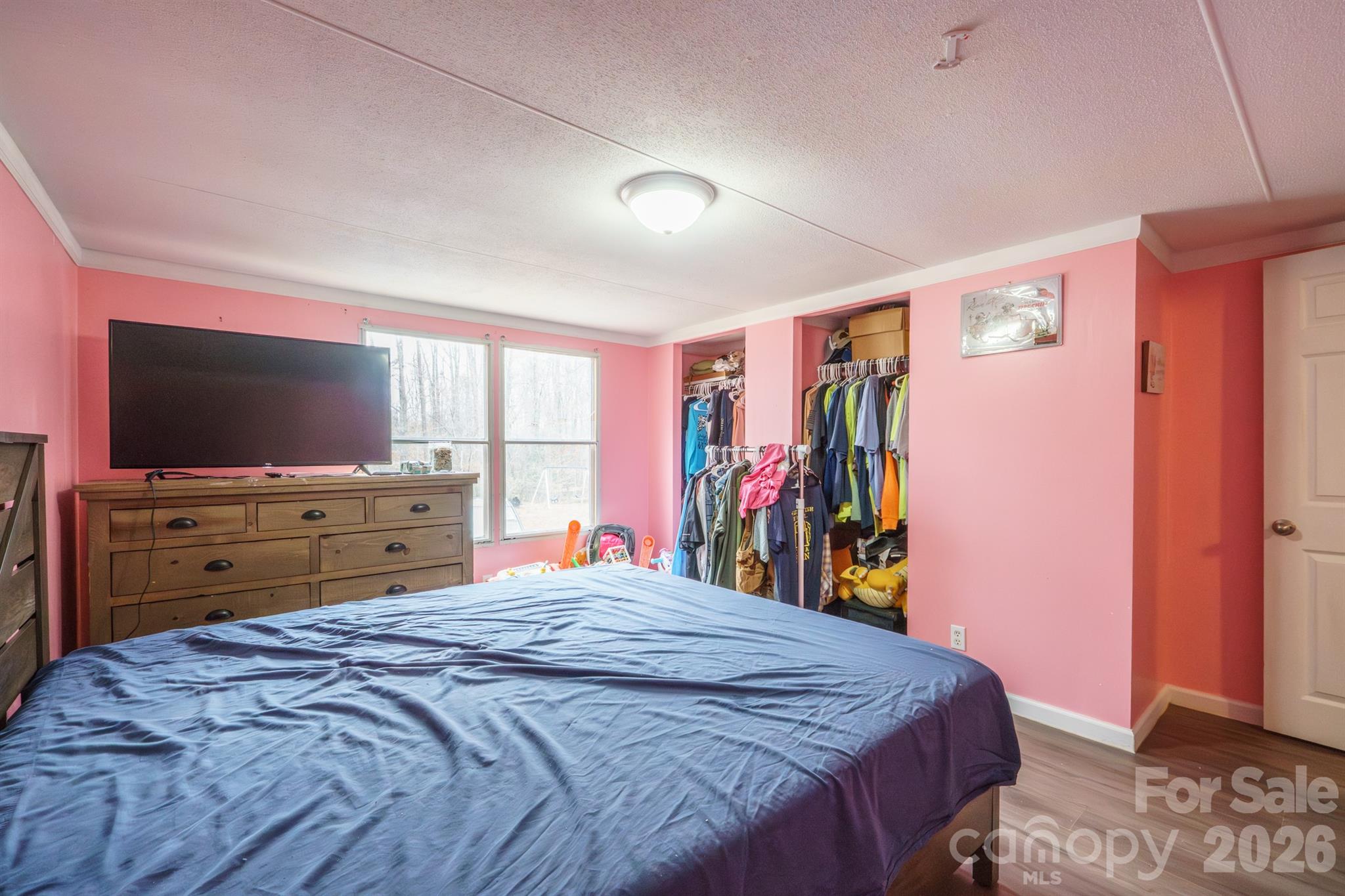 1775 Highway 70 Morganton, NC 28655 - Photo 15 of 18 a bed room with a bed and a flat tv screen