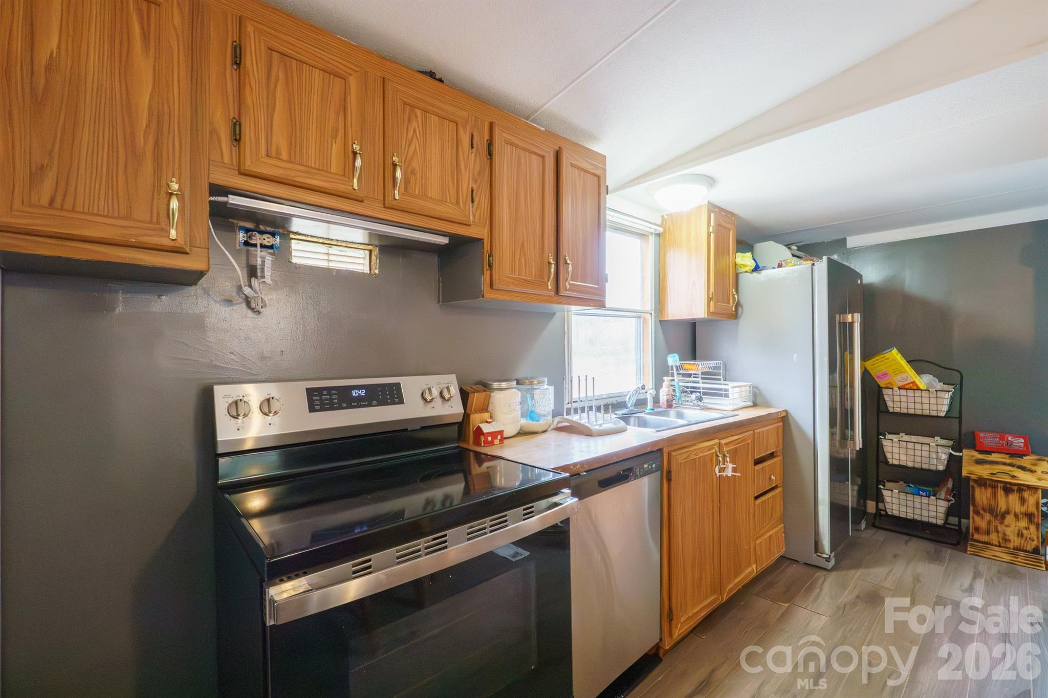 1775 Highway 70 Morganton, NC 28655 - Photo 8 of 18 a kitchen with a stove and a refrigerator