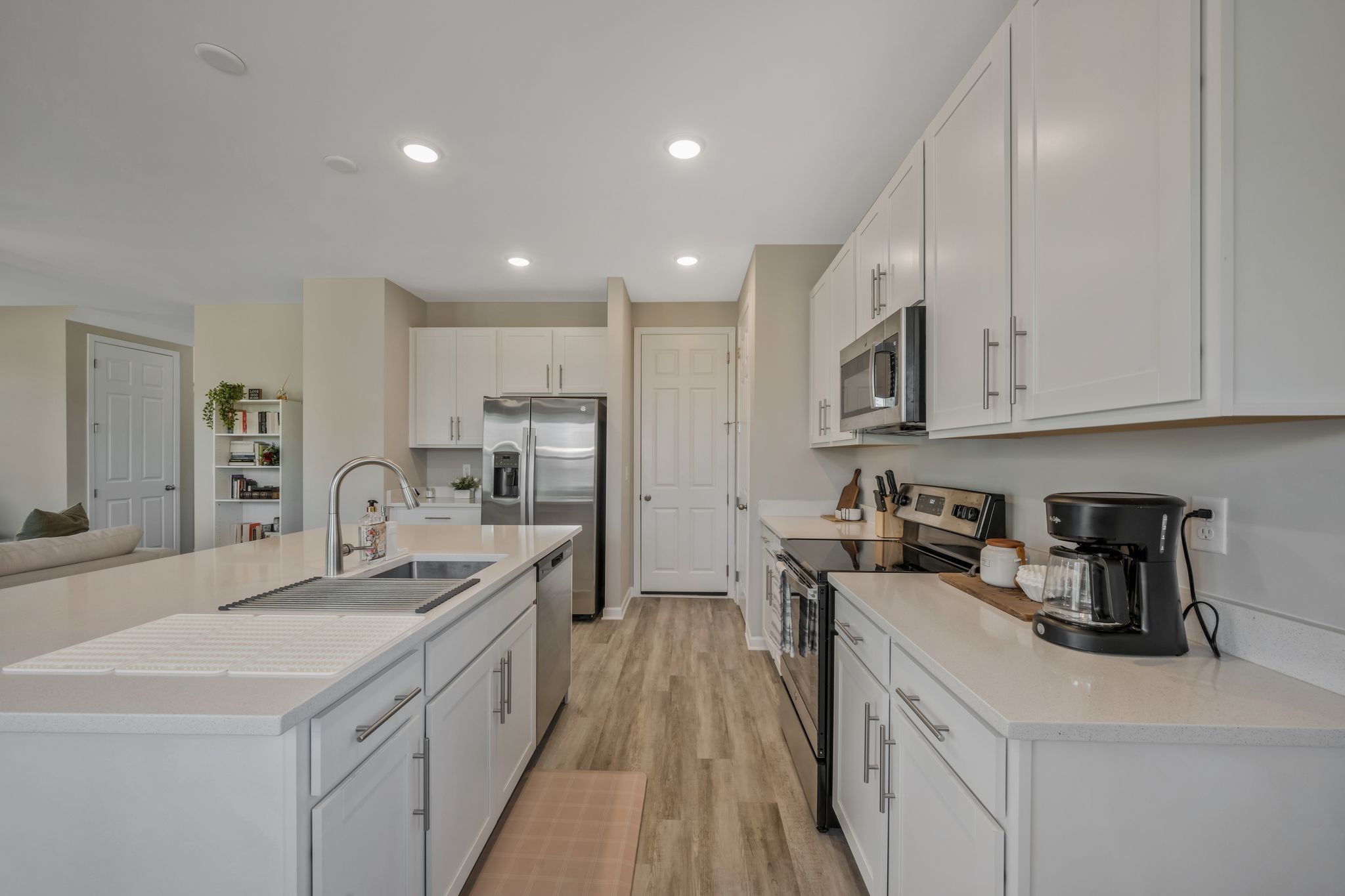 147 Timber Crest Trail White Bluff, TN 37187 - Photo 11 of 29 a kitchen with white cabinets sink and stainless steel appliances