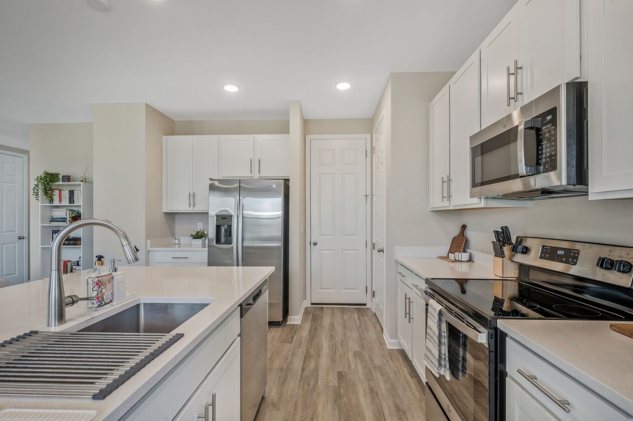 147 Timber Crest Trail White Bluff, TN 37187 - Photo 12 of 29 a kitchen with stainless steel appliances granite countertop a sink stove and refrigerator