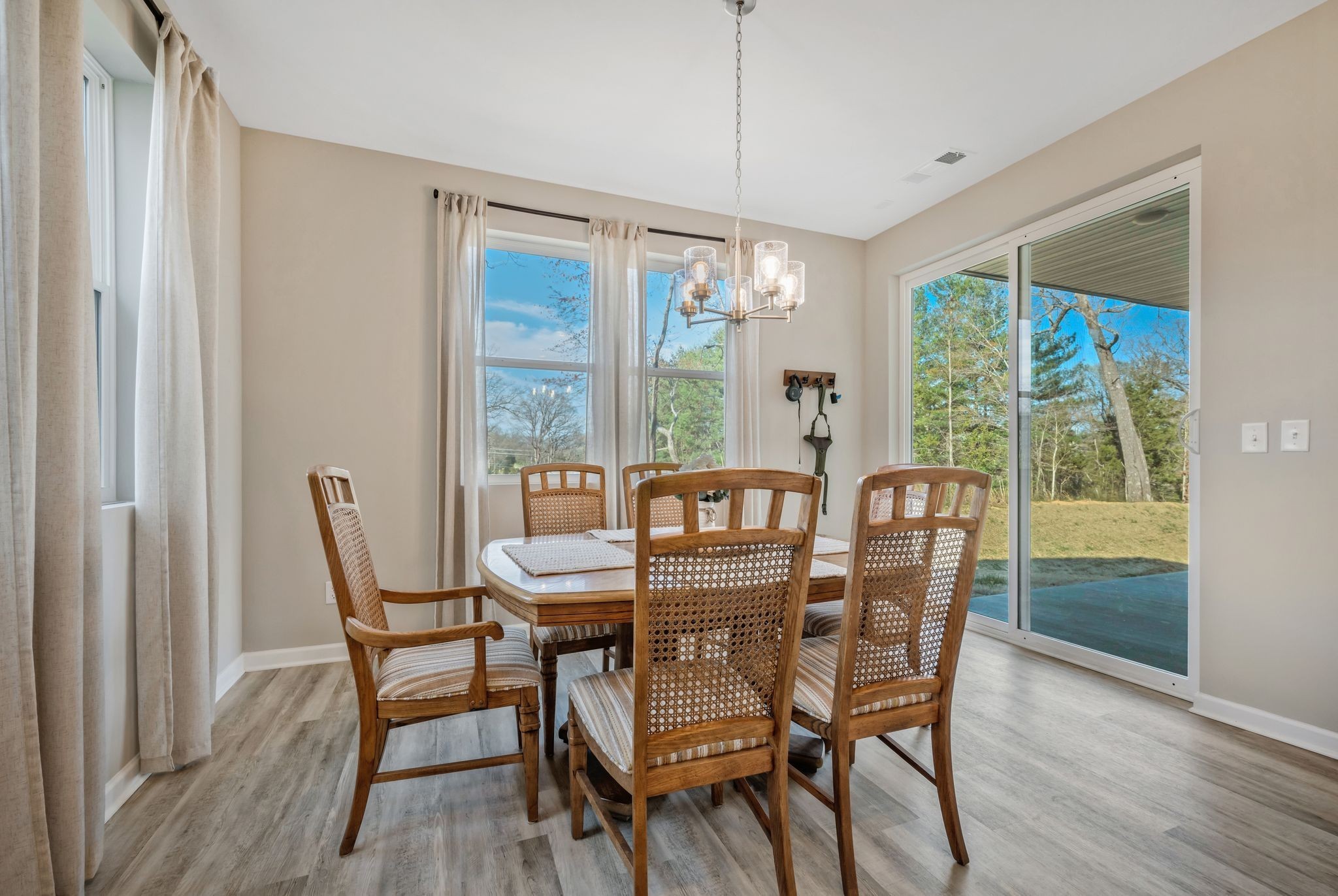 147 Timber Crest Trail White Bluff, TN 37187 - Photo 13 of 29 a dining room with furniture a chandelier and wooden floor