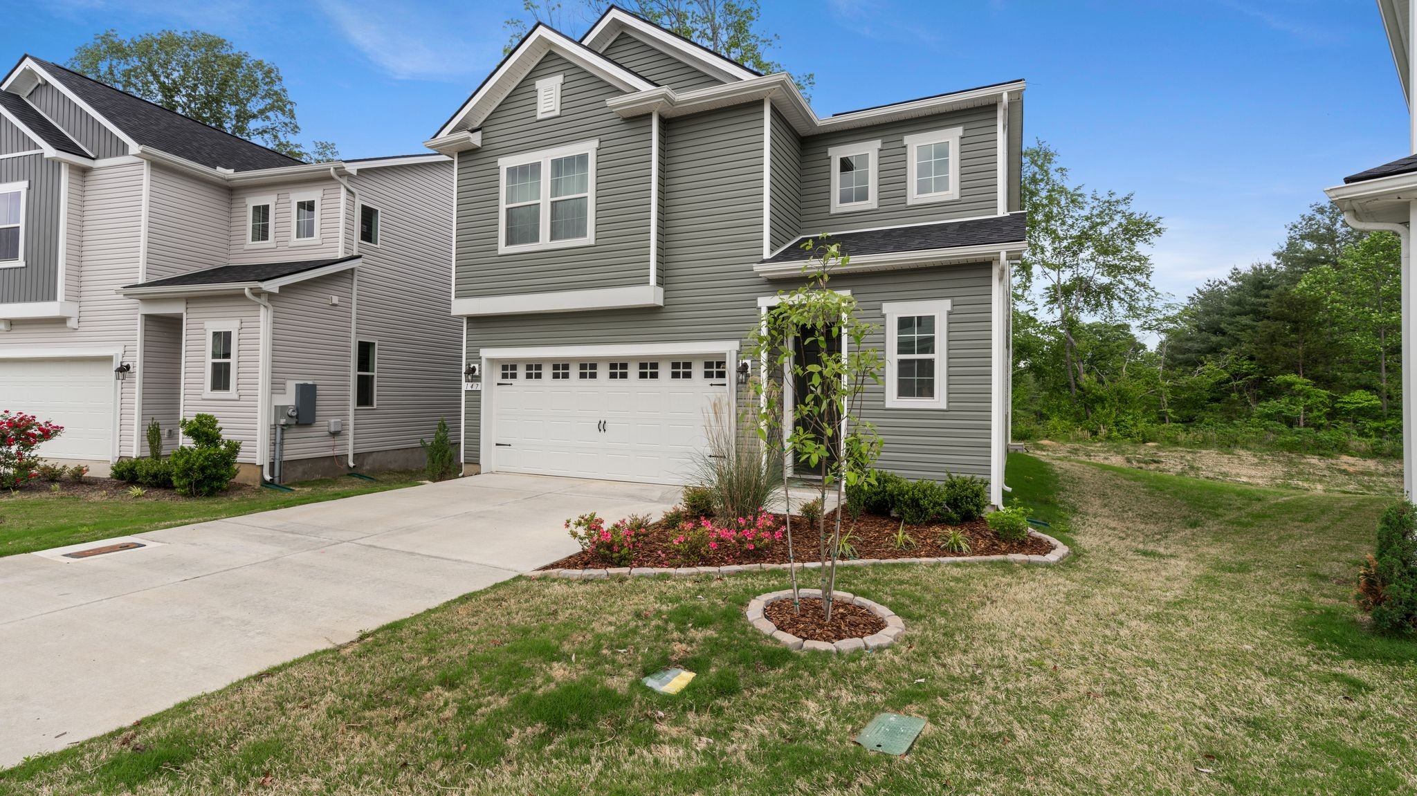 147 Timber Crest Trail White Bluff, TN 37187 - Photo 2 of 29 a front view of a house with garden