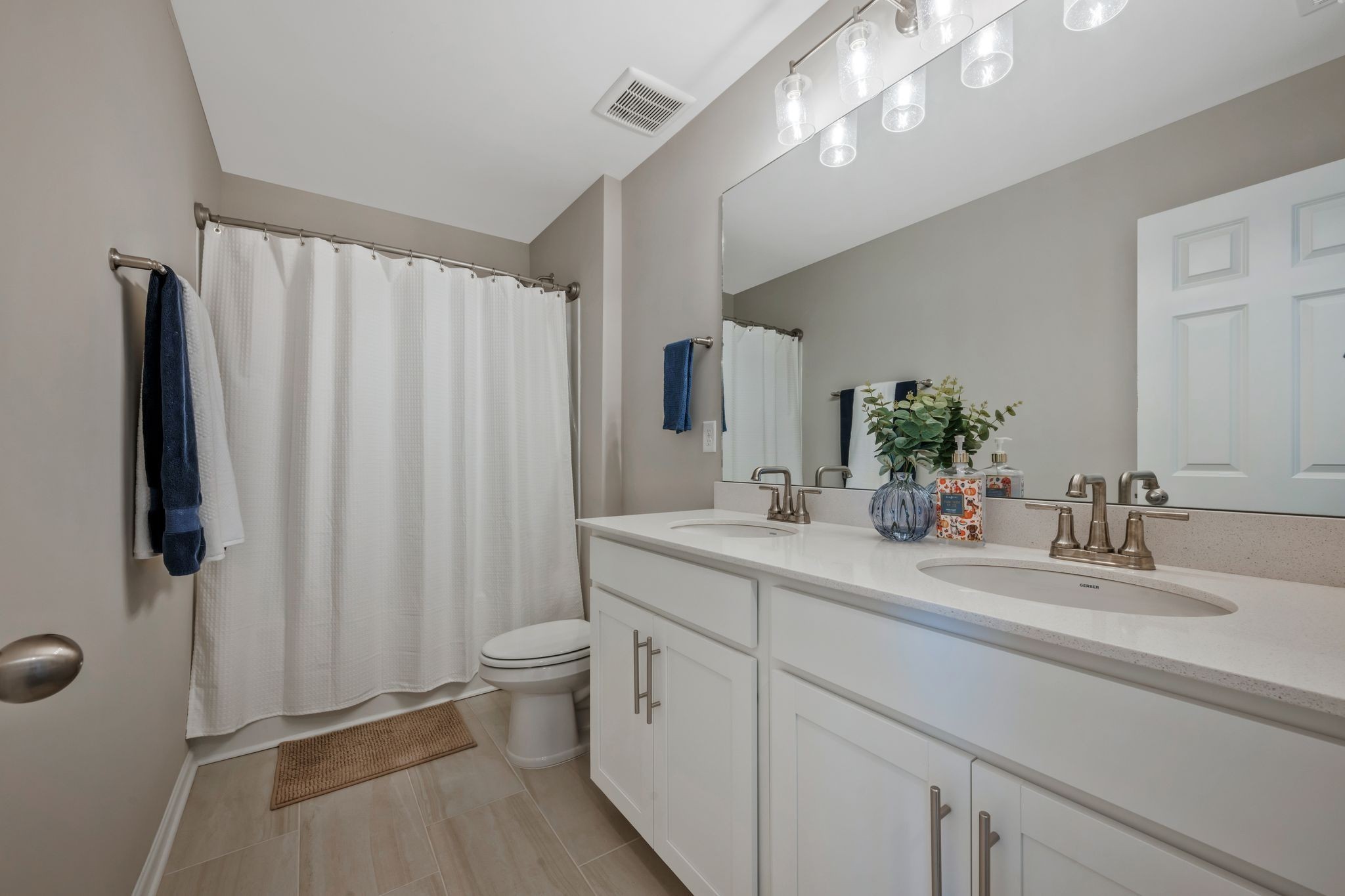 147 Timber Crest Trail White Bluff, TN 37187 - Photo 23 of 29 a bathroom with a double vanity sink mirror and toilet
