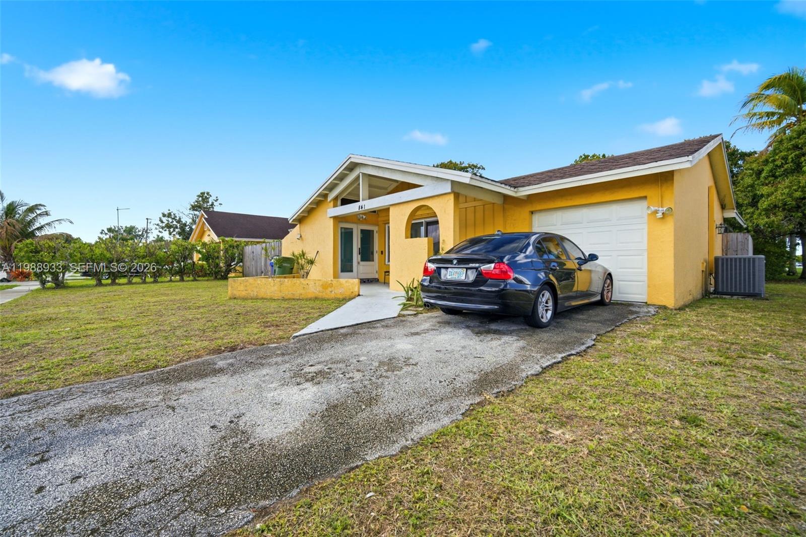 841 Southwest 55th Avenue Margate, FL 33068 - Photo 12 of 26 a house view with a garden space