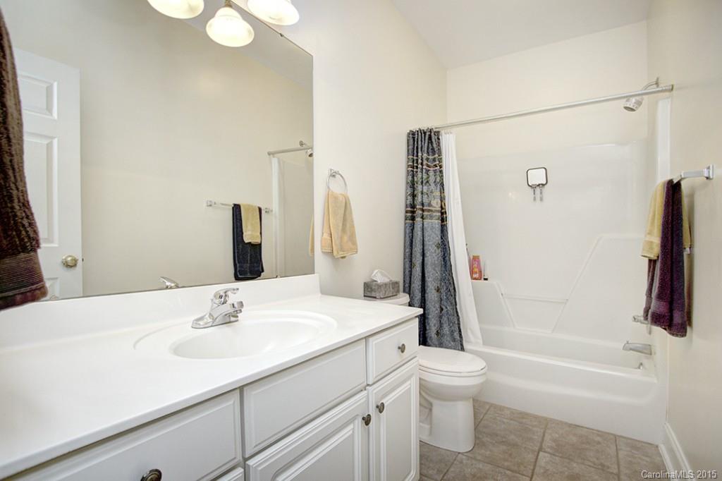 4108 Griffith Road Monroe, NC 28112 - Photo 14 of 23 a bathroom with a sink toilet tub and shower