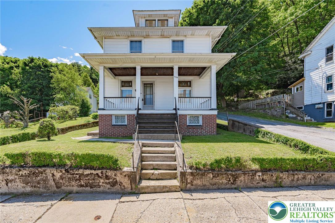 159 West Ridge Street Nesquehoning, PA 18240 - Photo 1 of 55 A classic facade with a welcoming porch and vibrant green landscaping offers appealing curb presence.