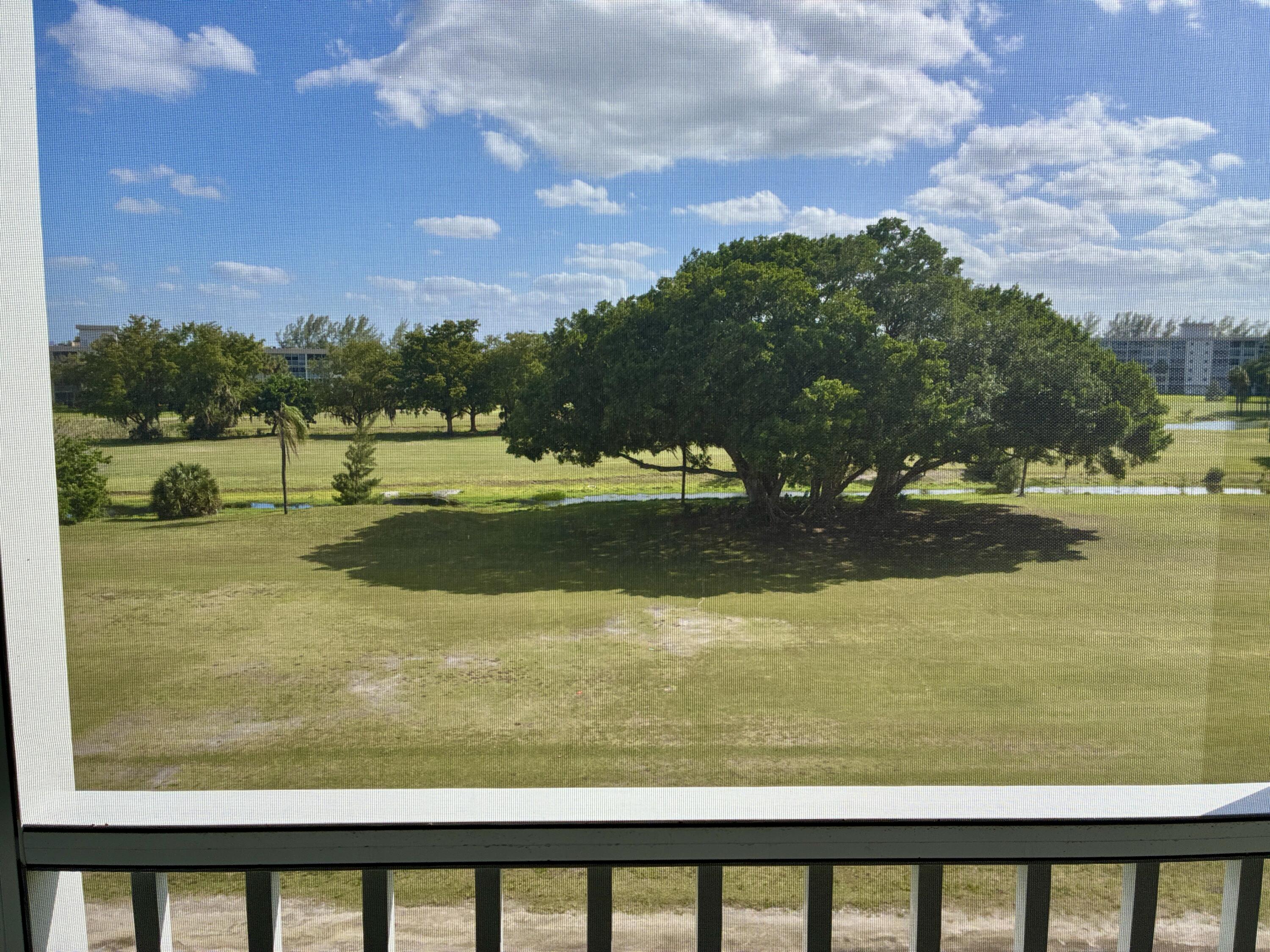2691 South Course Drive, Unit 409 Pompano Beach, FL 33069 - Photo 18 of 22 a view of a lake