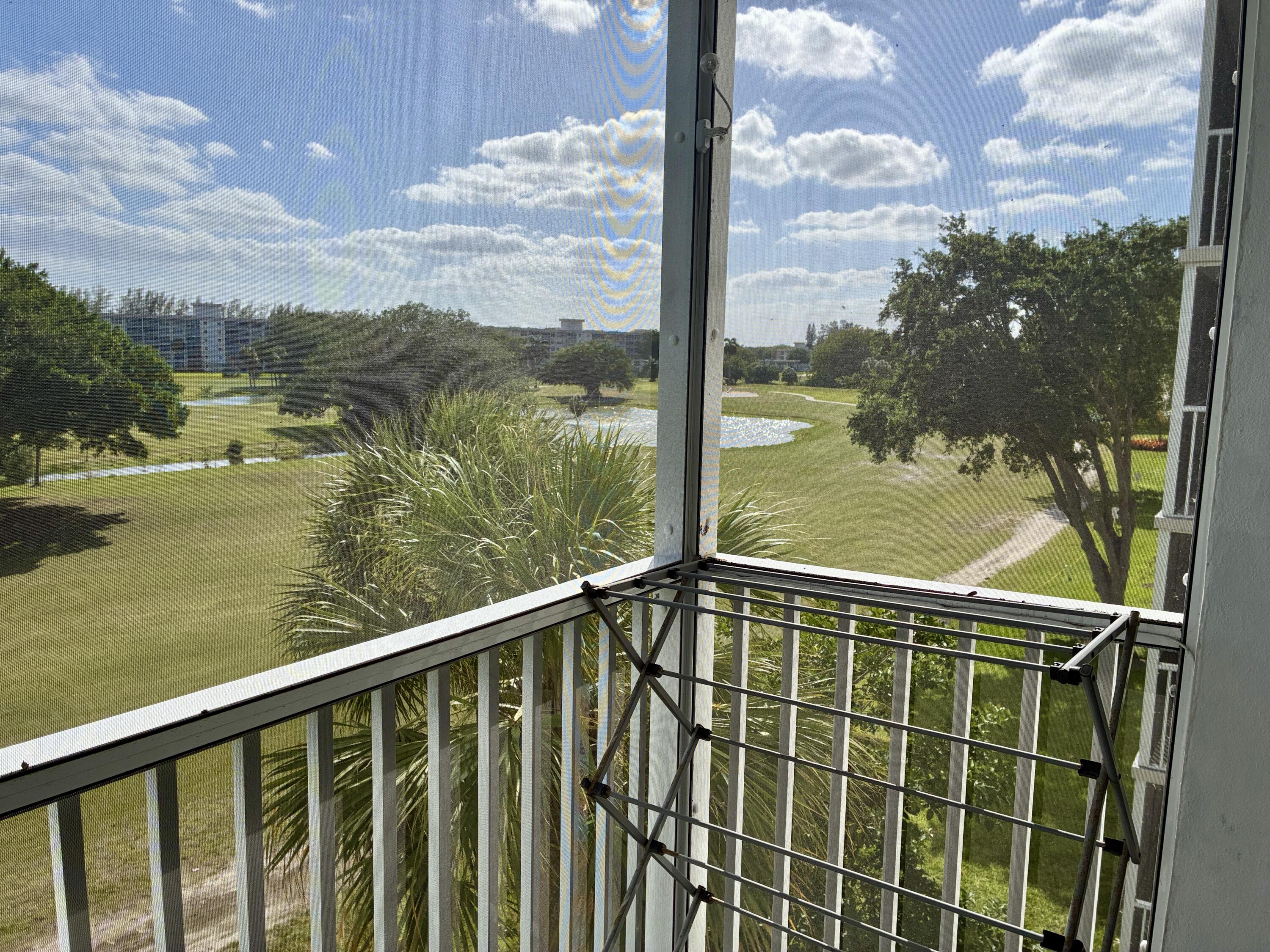 2691 South Course Drive, Unit 409 Pompano Beach, FL 33069 - Photo 20 of 22 a view of lake from balcony