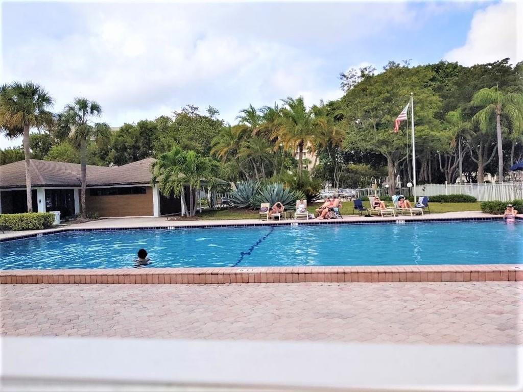 2691 South Course Drive, Unit 409 Pompano Beach, FL 33069 - Photo 21 of 22 a view of houses with outdoor space