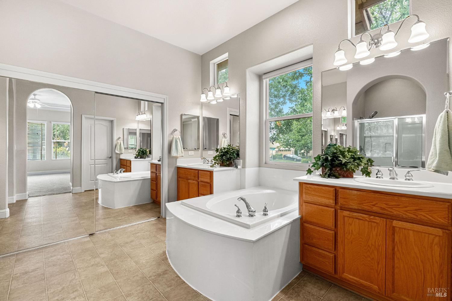 408 Willow Brook Way Rio Vista, CA 94571 - Photo 24 of 79 primary bathroom - the large mirrored wardrobe doors on the left access a very generous walk-in closet