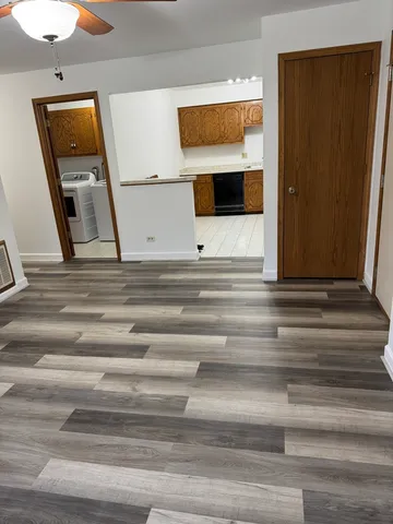 a kitchen with cabinets and stainless steel appliances