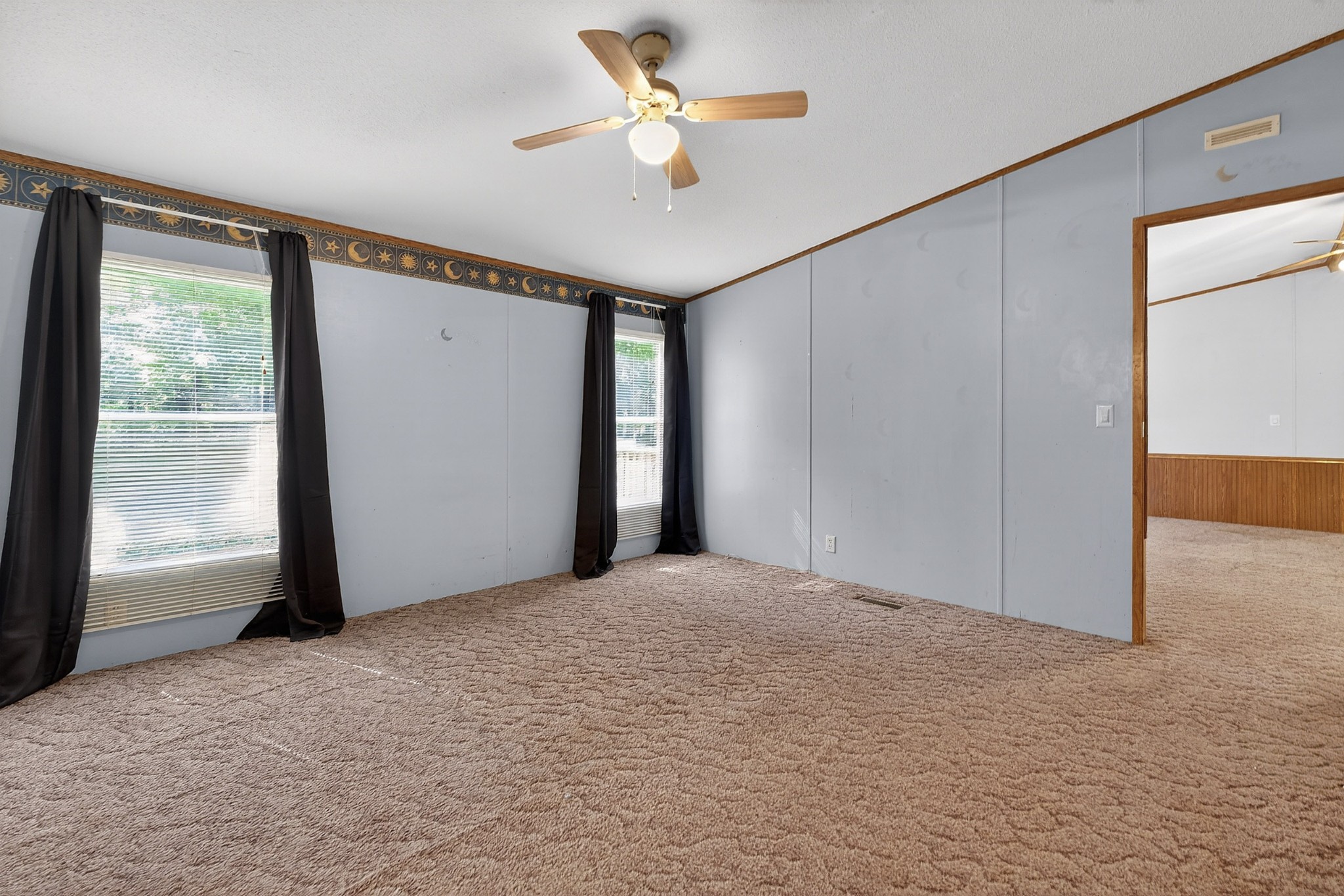228 Shasteen Ridge Road Lynchburg, TN 37352 - Photo 32 of 53 a view of a livingroom with a ceiling fan and window