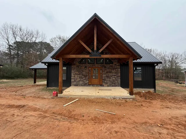 a front view of a house with yard