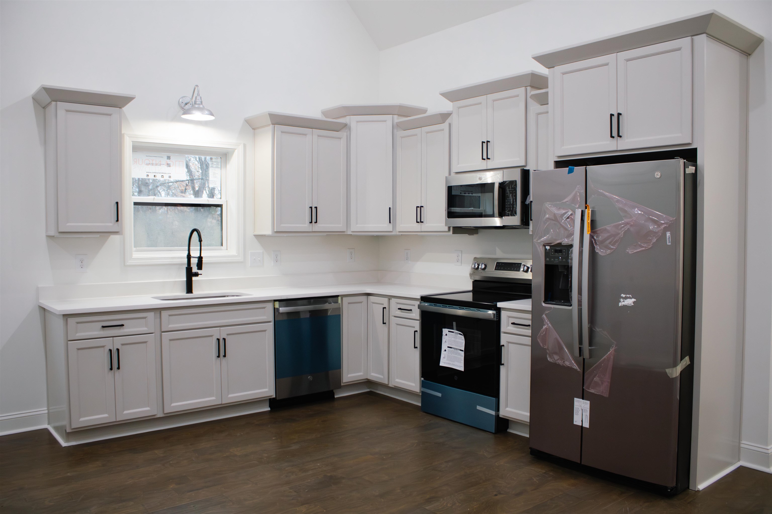 273 Oakgrove Road Selmer, TN 38375 - Photo 5 of 17 a kitchen with stainless steel appliances granite countertop a refrigerator and a stove top oven