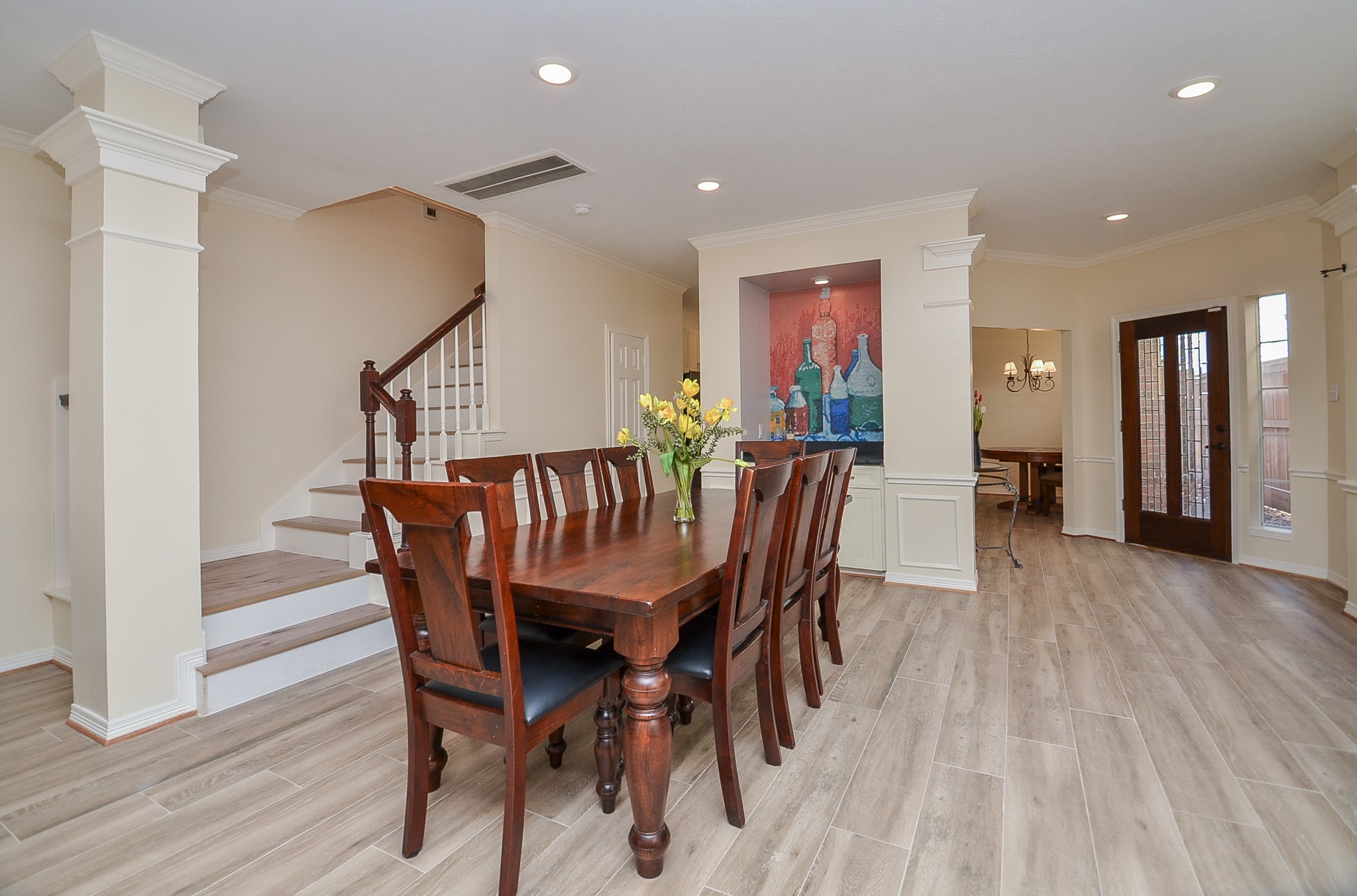 4916 Inker Street Houston, TX 77007 - Photo 35 of 36 Heading back down the stairs with one more view of the graceful entrance and room this home offers.
