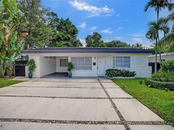 front view of a house with a yard