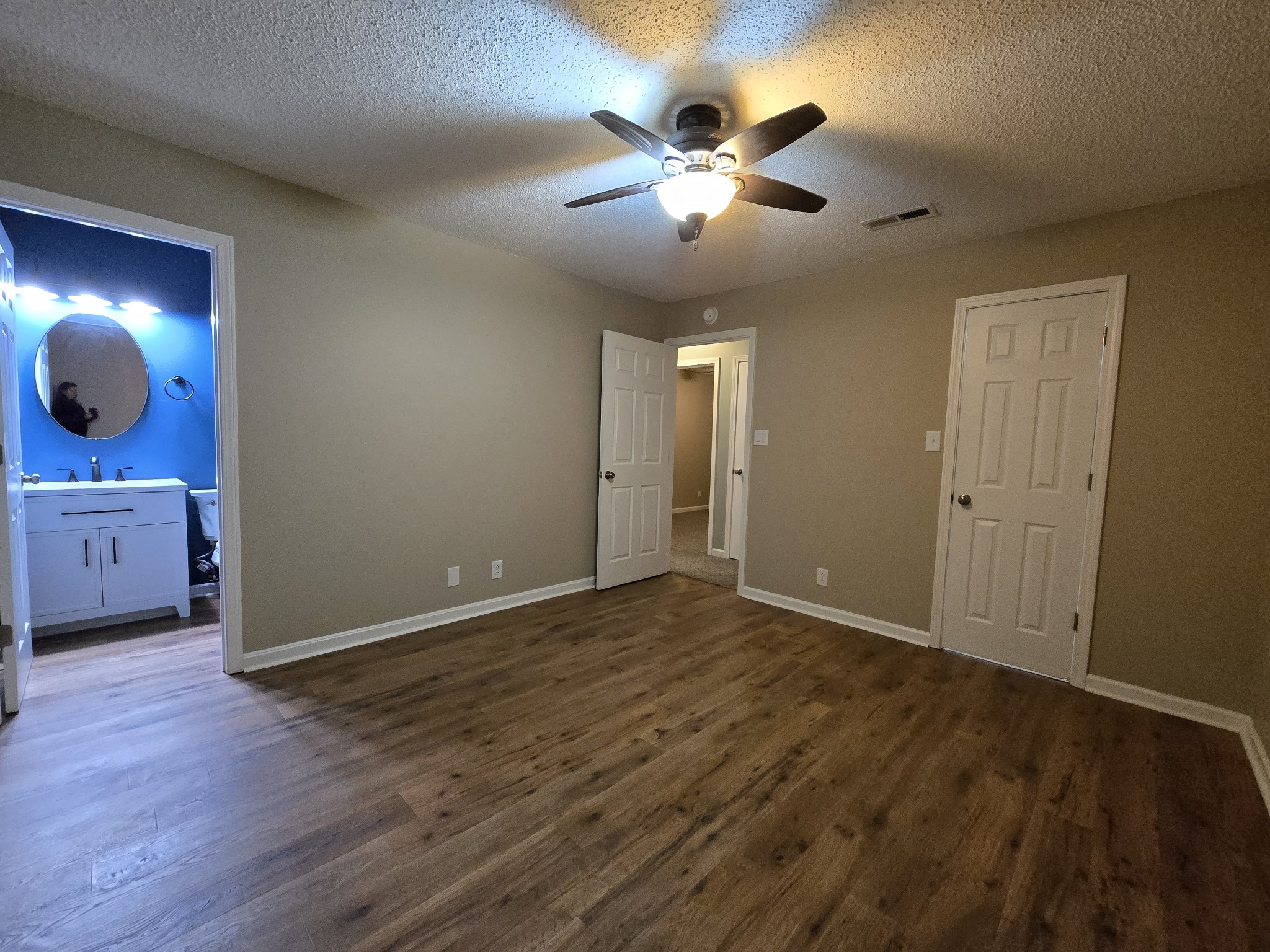 337 Bumpus Mill Road Oak Grove, KY 42262 - Photo 19 of 22 a view of an empty room with wooden floor and cabinet