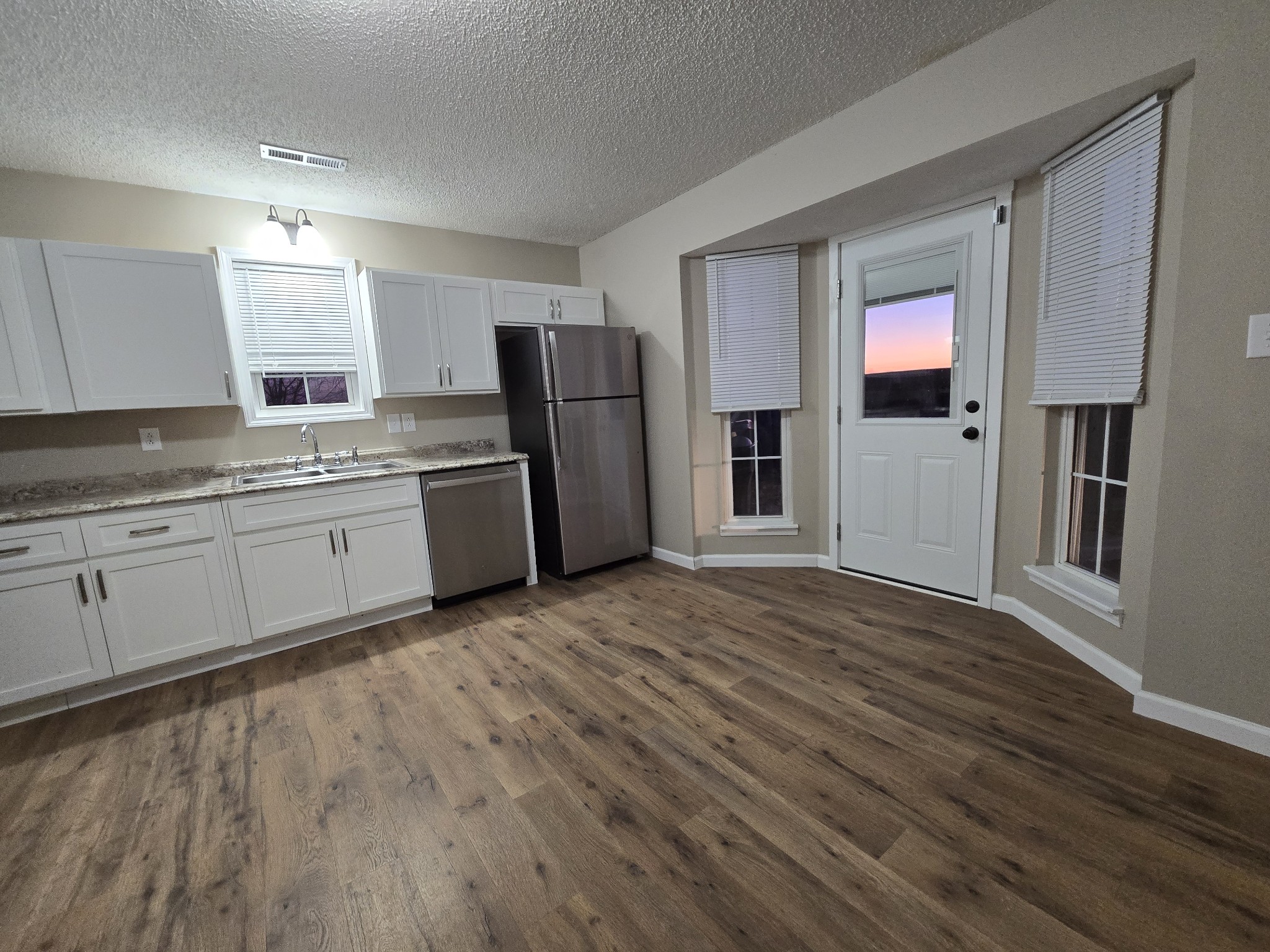 337 Bumpus Mill Road Oak Grove, KY 42262 - Photo 8 of 22 a kitchen with stainless steel appliances granite countertop a refrigerator and a stove top oven