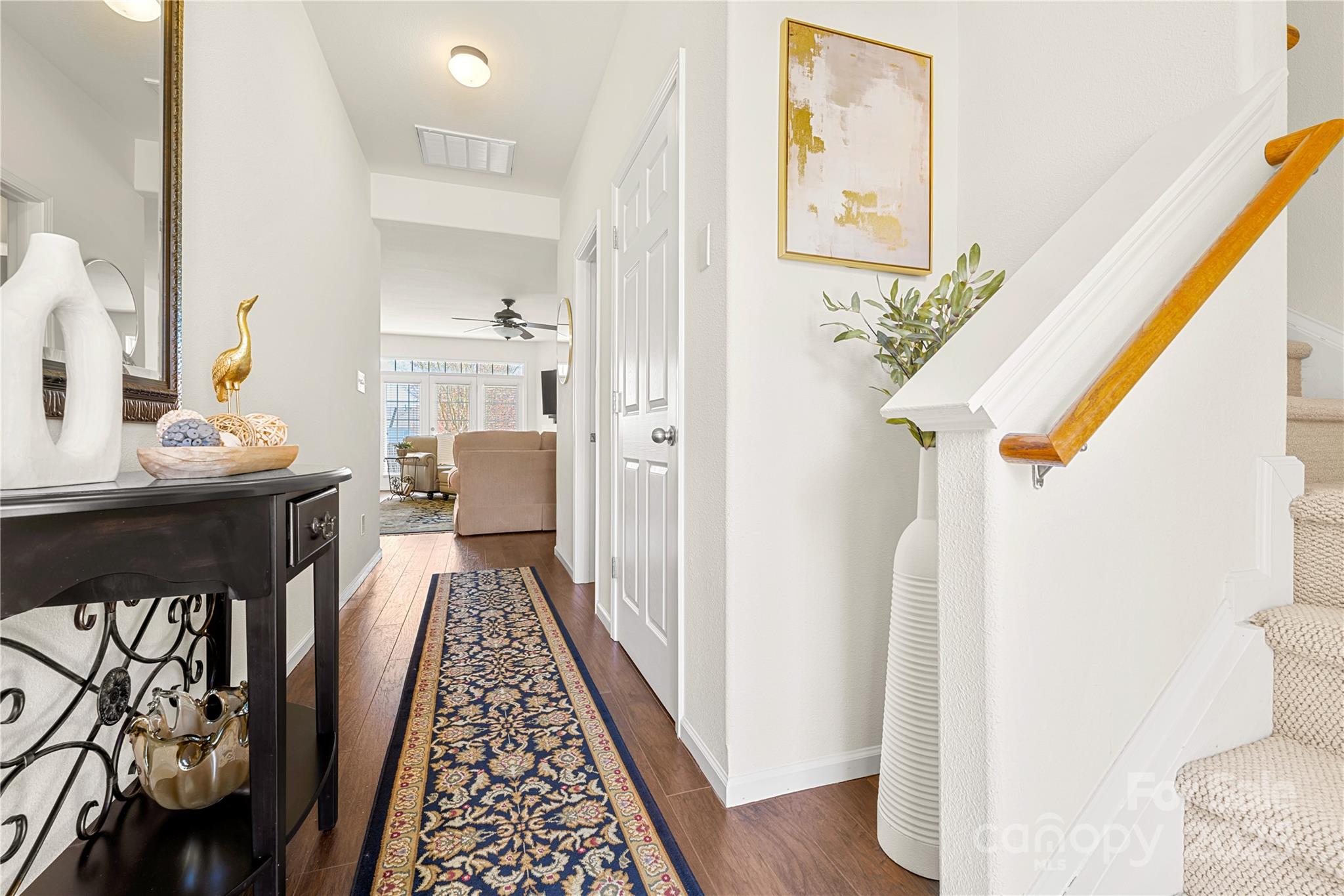 2443 Redmayne Lane Fort Mill, SC 29707 - Photo 13 of 43 a hallway with a dining table chairs and couches