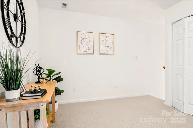 an entryway with a flower pot