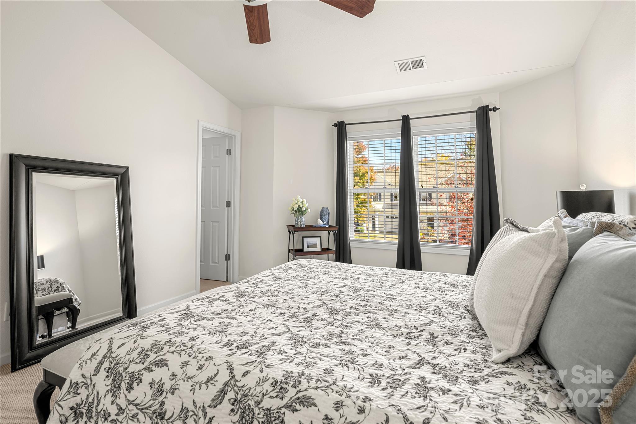 2443 Redmayne Lane Fort Mill, SC 29707 - Photo 21 of 43 a bedroom with a large bed and a large window