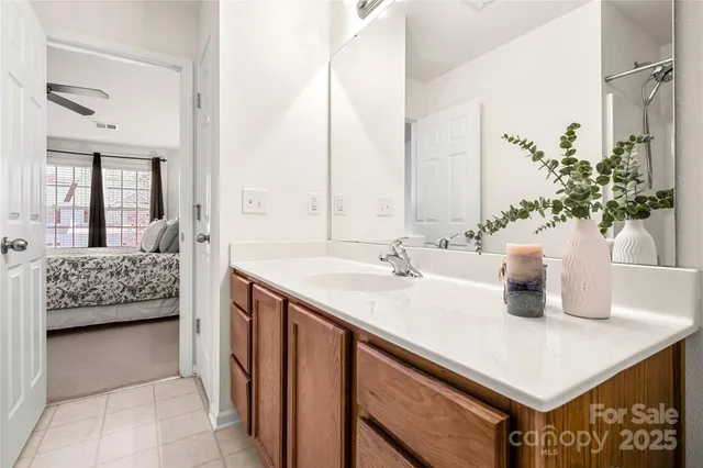 a bathroom with a sink a vanity and a mirror