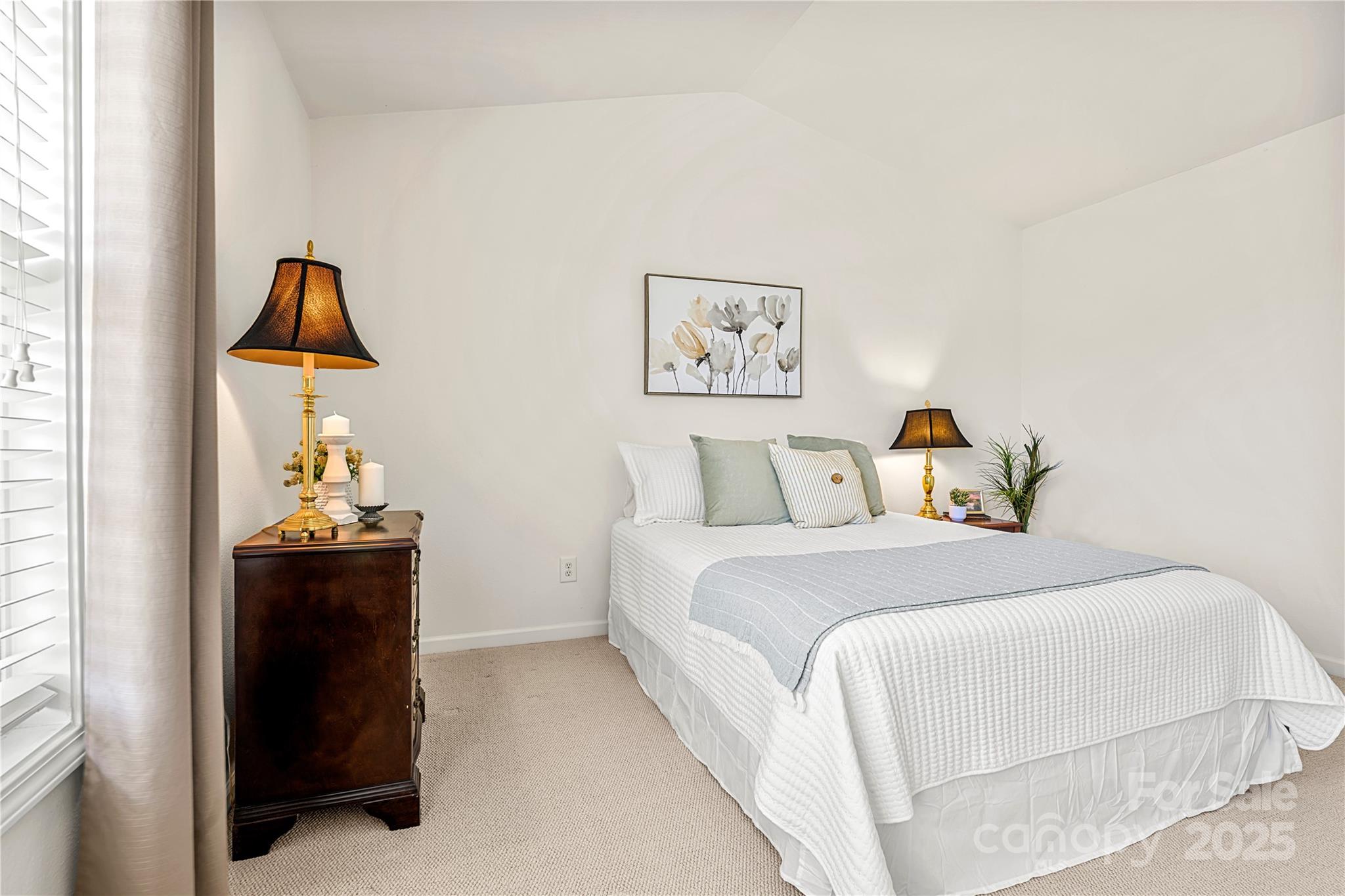 2443 Redmayne Lane Fort Mill, SC 29707 - Photo 26 of 43 a bedroom with a bed and a painting on the wall