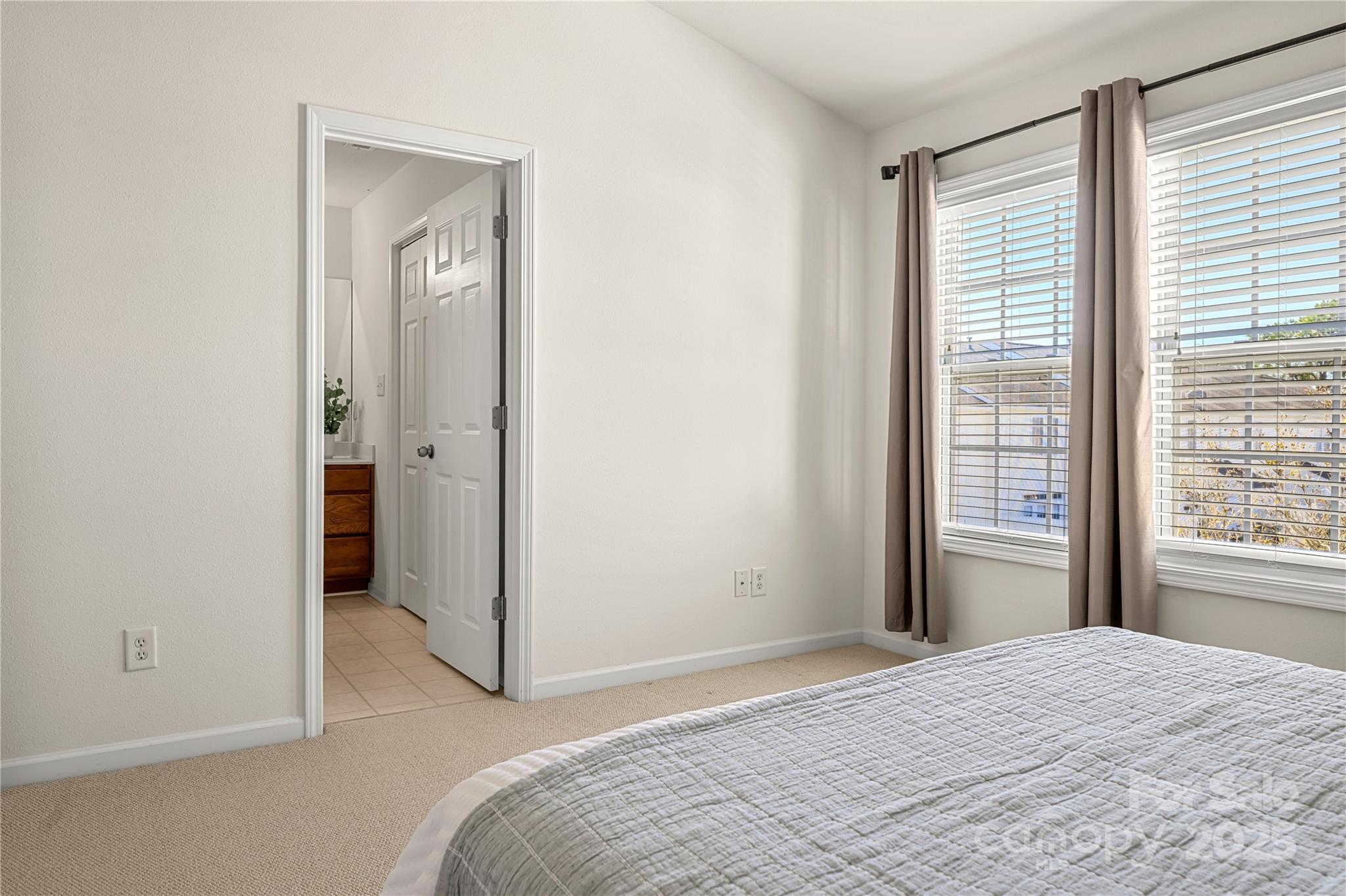 2443 Redmayne Lane Fort Mill, SC 29707 - Photo 27 of 43 a bedroom with a bed and a window