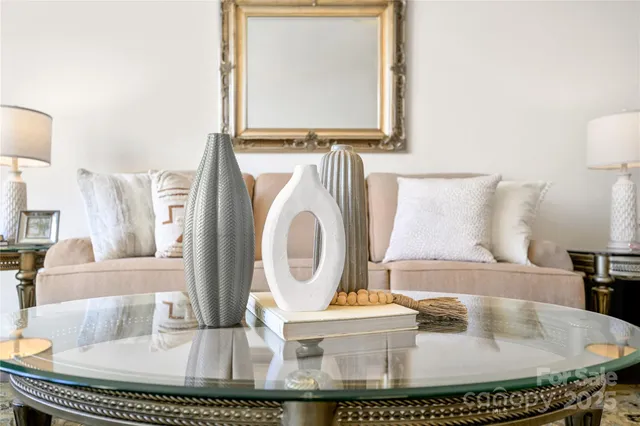 a living room with furniture and a table