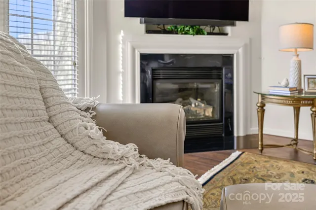 a bedroom with a bed and a fireplace