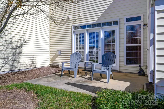 a bench sitting in front of a house