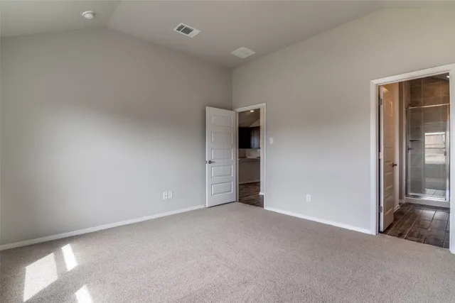 an empty room with an entrance and door