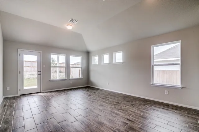a view of an empty room with a window