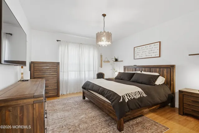 a bedroom with a bed and dresser