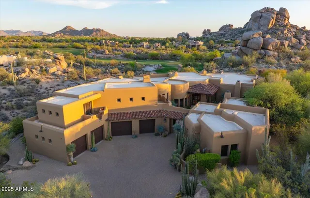 an aerial view of a house with a garden