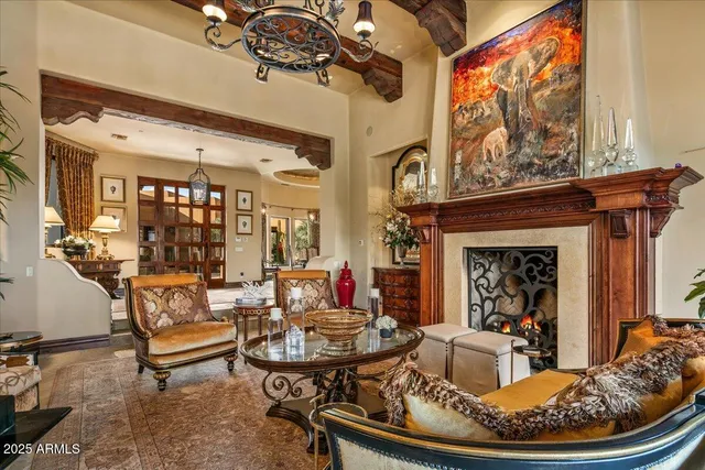 a dining room with furniture a chandelier and wooden floor